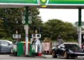 Cars wait at a BP petrol and diesel filling station, Llanteg, Pembrokeshire, Wales, Britain, September 24, 2021. REUTERS/Rebecca Naden