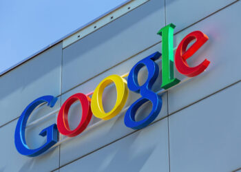 Zurich, Switzerland - 24 June, 2015: Google sign on the wall of the Google office building. Google is a multinational technology company specializing in Internet-related services and products.