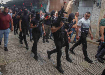 NABLUS, PALESTINE - 2022/08/23: Gunmen take part in the funeral of 25-year-old Palestinian Mohammed Al-Arashi. Al-Arashi was killed as a result of his wounds sustained on August 9, when the Israeli army shot him during a raid in the city of Nablus in the occupied West Bank. (Photo by Nasser Ishtayeh/SOPA Images/LightRocket via Getty Images)