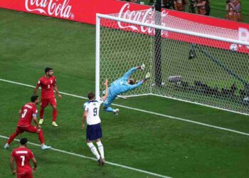 Soccer Football - FIFA World Cup Qatar 2022 - Group B - England v Iran - Khalifa International Stadium, Doha, Qatar - November 21, 2022 England's Bukayo Saka scores their second goal past Iran's Hossein Hosseini REUTERS/Marko Djurica