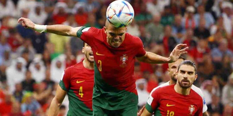 Soccer Football - FIFA World Cup Qatar 2022 - Round of 16 - Portugal v Switzerland - Lusail Stadium, Lusail, Qatar - December 6, 2022 Portugal's Pepe heads at goal REUTERS/Kai Pfaffenbach