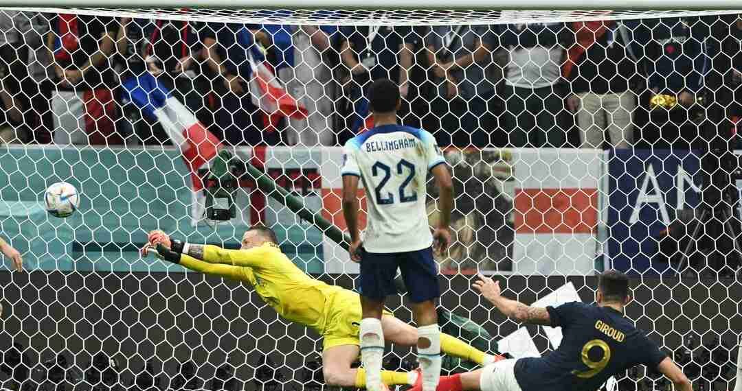 Soccer Football - FIFA World Cup Qatar 2022 - Quarter Final - England v France - Al Bayt Stadium, Al Khor, Qatar - December 10, 2022 England's Jordan Pickford saves a shot from France's Olivier Giroud REUTERS/Dylan Martinez