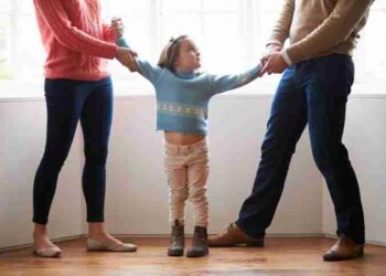 Two Parents Fighting Over Child In Divorce Concept