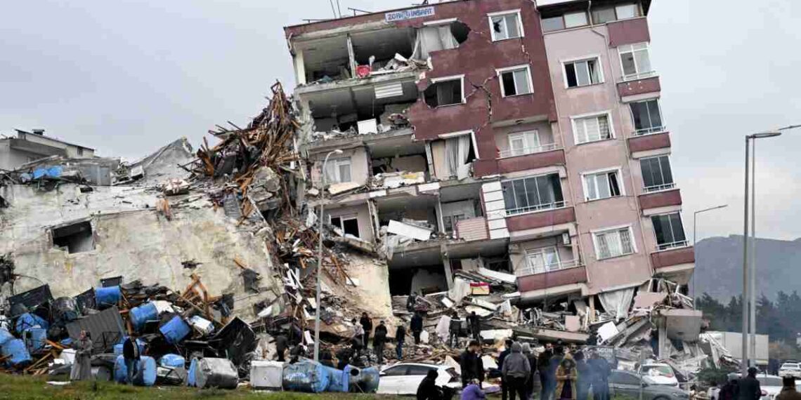 HATAY, TURKIYE - FEBRUARY 06: A view of a collapsed building in Hatay, Turkiye after 7.7 and 7.6 magnitude earthquakes hits Turkiye's Hatay, on February 06, 2023. Disaster and Emergency Management Authority (AFAD) of Turkiye said the 7.7 magnitude quake struck at 4.17 a.m. (0117GMT) and was centered in the Pazarcik district and 7.6 magnitude quake struck in Elbistan district in the province of Kahramanmaras in the south of Turkiye. Gaziantep, Sanliurfa, Diyarbakir, Adana, Adiyaman, Malatya, Osmaniye, Hatay, and Kilis provinces are heavily affected by the earthquakes. (Photo by Ercin Erturk/Anadolu Agency via Getty Images)