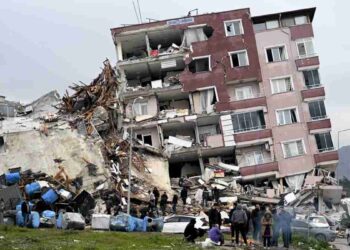 HATAY, TURKIYE - FEBRUARY 06: A view of a collapsed building in Hatay, Turkiye after 7.7 and 7.6 magnitude earthquakes hits Turkiye's Hatay, on February 06, 2023. Disaster and Emergency Management Authority (AFAD) of Turkiye said the 7.7 magnitude quake struck at 4.17 a.m. (0117GMT) and was centered in the Pazarcik district and 7.6 magnitude quake struck in Elbistan district in the province of Kahramanmaras in the south of Turkiye. Gaziantep, Sanliurfa, Diyarbakir, Adana, Adiyaman, Malatya, Osmaniye, Hatay, and Kilis provinces are heavily affected by the earthquakes. (Photo by Ercin Erturk/Anadolu Agency via Getty Images)