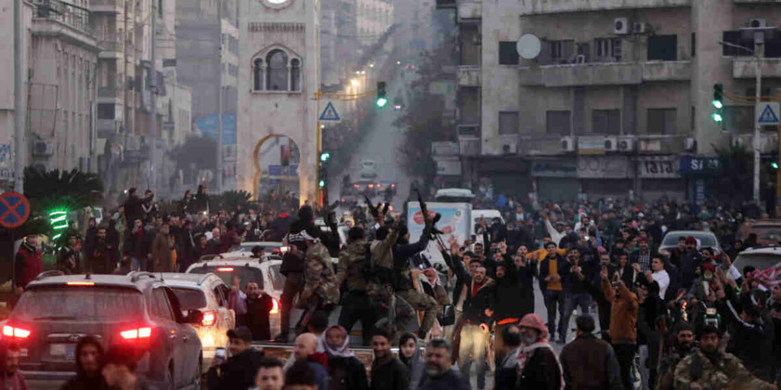 Residents take to the streets of Hama, to welcome anti government fighters after they took control of Syria's west-central city on December 5, 2024. Islamist-led rebels captured the central Syrian city of Hama on December 5, days after seizing the country's commercial hub Aleppo in a lightning offensive against President Bashar al-Assad's forces. (Photo by Bakr ALKASEM / AFP) / The erroneous PHOTOGRAPHER appearing in the metadata of this photo has been modified in AFP systems in the following manner: [Bakr ALKASEM] instead of [Rami AL SAYED]. Please immediately remove the erroneous mention[s] from all your online services and delete it (them) from your servers. If you have been authorized by AFP to distribute it (them) to third parties, please ensure that the same actions are carried out by them. Failure to promptly comply with these instructions will entail liability on your part for any continued or post notification usage. Therefore we thank you very much for all your attention and prompt action. We are sorry for the inconvenience this notification may cause and remain at your disposal for any further information you may require.